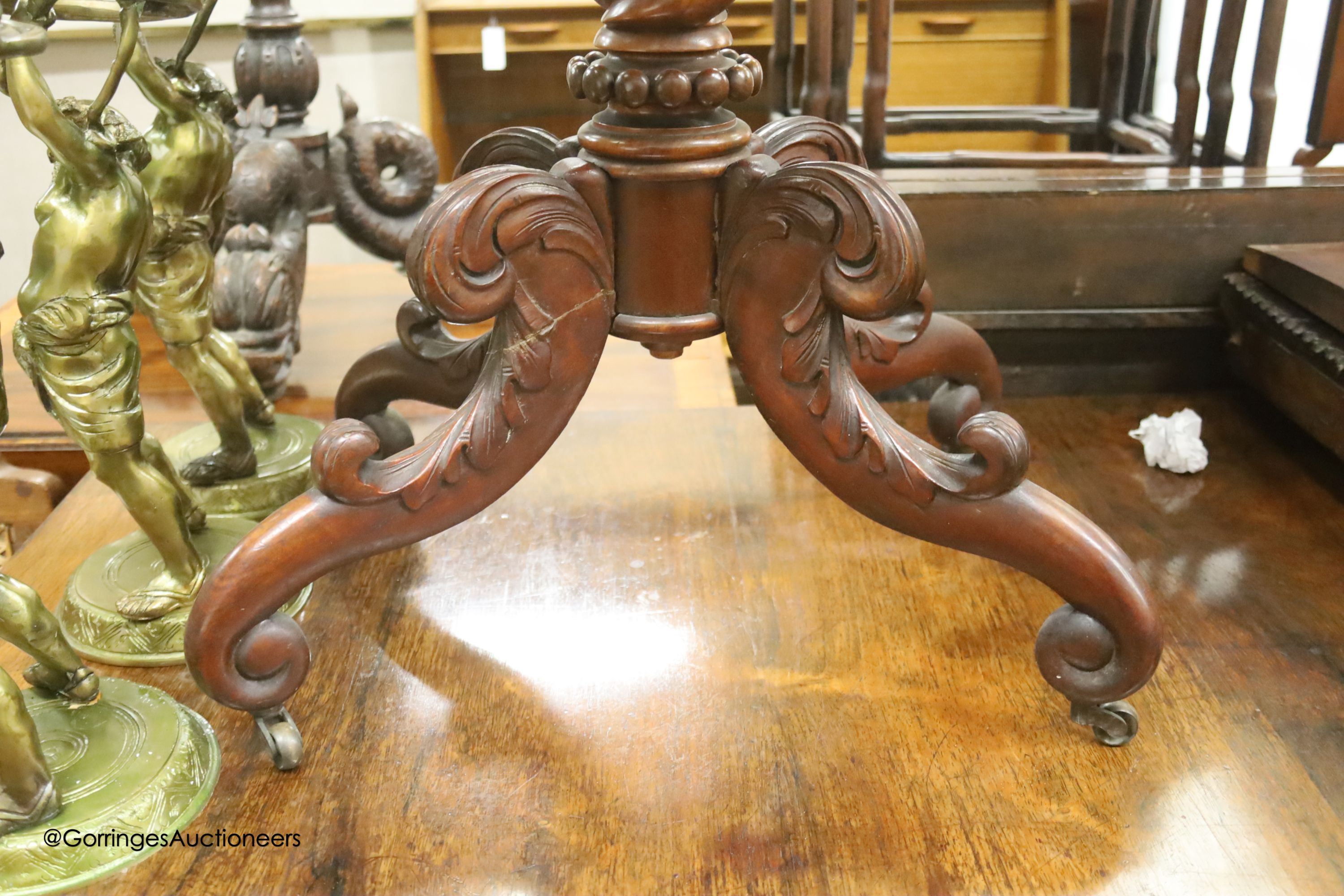 An oval French flamed mahogany occasional table, width 70cm, depth 52cm, height 74cm